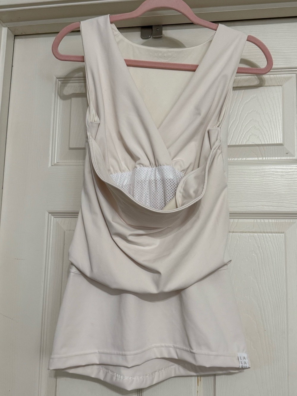 Lalabu baby wearing Tank Top Cream Size Medium